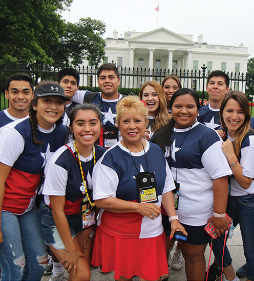Esther Dominguez, center, surrounded by some of the Texas teens in front of the White House in 2018. She is Texas Electric Cooperatives’ youth tour coordinator and has been involved with the program since 1994. This year Texas will send 124 teens and 19 chaperones to Washington.  Photo courtesy Esther Dominguez