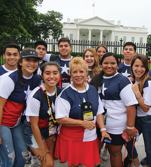 Esther Dominguez, center, surrounded by some of the Texas teens in front of the White House in 2018. She is Texas Electric Cooperatives’ youth tour coordinator and has been involved with the program since 1994. This year Texas will send 124 teens and 19 chaperones to Washington. Photo courtesy Esther Dominguez