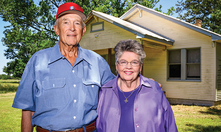 Oscar Dube Jr. and his wife, Loretta, recently visited the family farmhouse on Wolf Road in McDade, half a mile from their current ranch home. (Sarah Beal photo)
