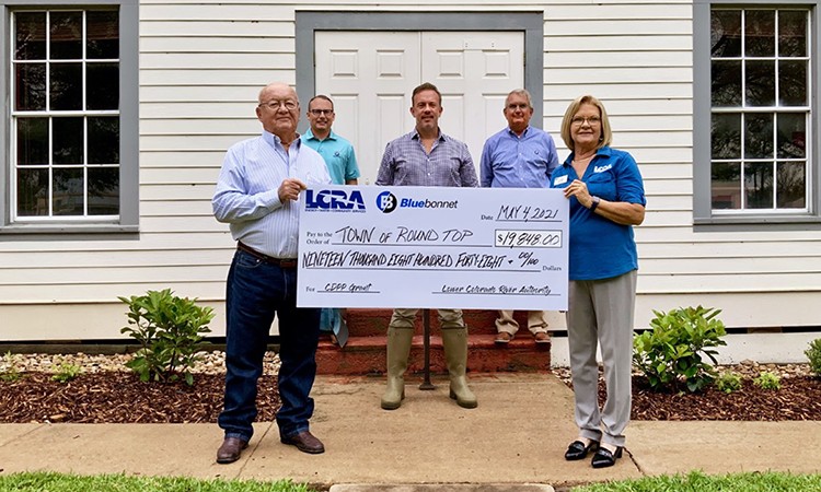 Bluebonnet Electric Cooperative and LCRA present a $19,848 grant to Round Top for new downtown lighting.