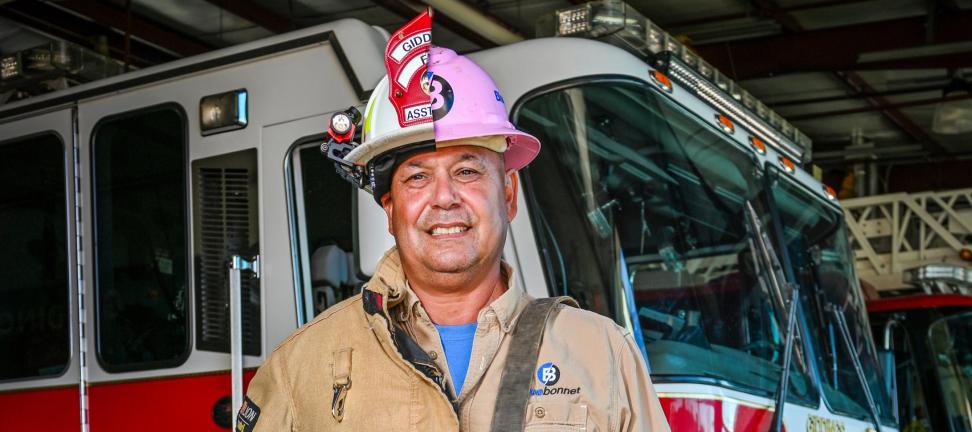 Photo illustration of Rudy Garcia in a lineworker and firefighter uniform.